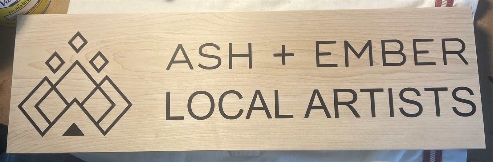 Ash + Ember storefront sign